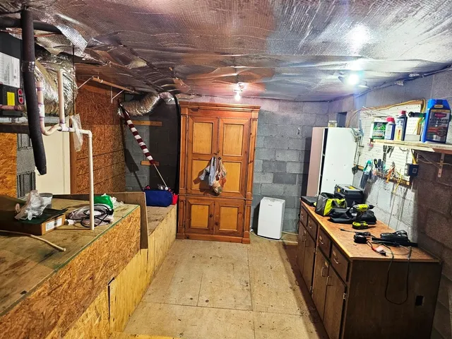 a room with lots of wooden furniture and a table