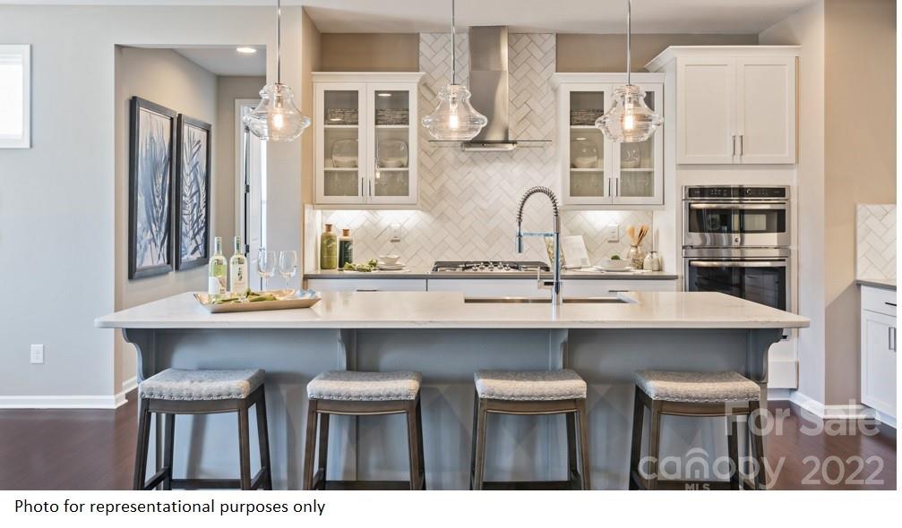 4039 Charlton Road, Unit 276 Fort Mill, SC 29715 - Photo 11 of 29 a kitchen with cabinets and wooden floor