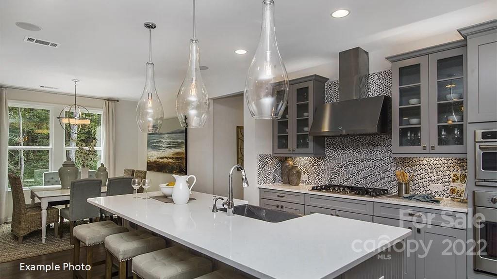 4039 Charlton Road, Unit 276 Fort Mill, SC 29715 - Photo 13 of 29 a kitchen with stainless steel appliances granite countertop a sink a stove and a refrigerator
