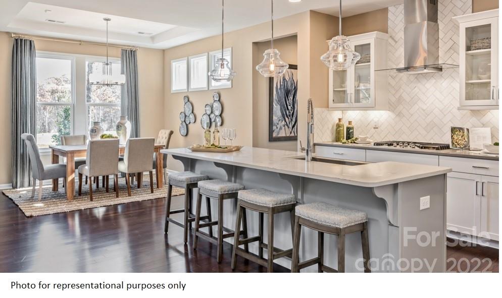 4039 Charlton Road, Unit 276 Fort Mill, SC 29715 - Photo 16 of 29 a kitchen with a table and chairs in it