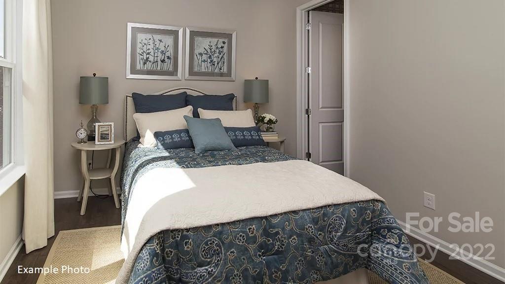 4039 Charlton Road, Unit 276 Fort Mill, SC 29715 - Photo 19 of 29 a bedroom with a bed and painting on the wall