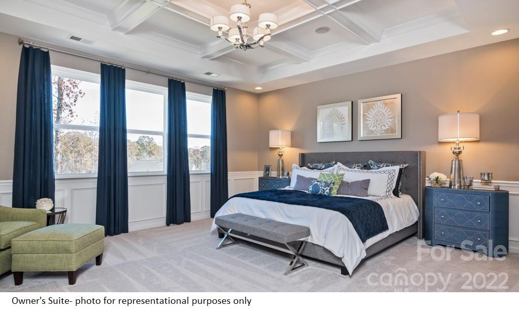 4039 Charlton Road, Unit 276 Fort Mill, SC 29715 - Photo 26 of 29 a bedroom with a bed mirror and a large window