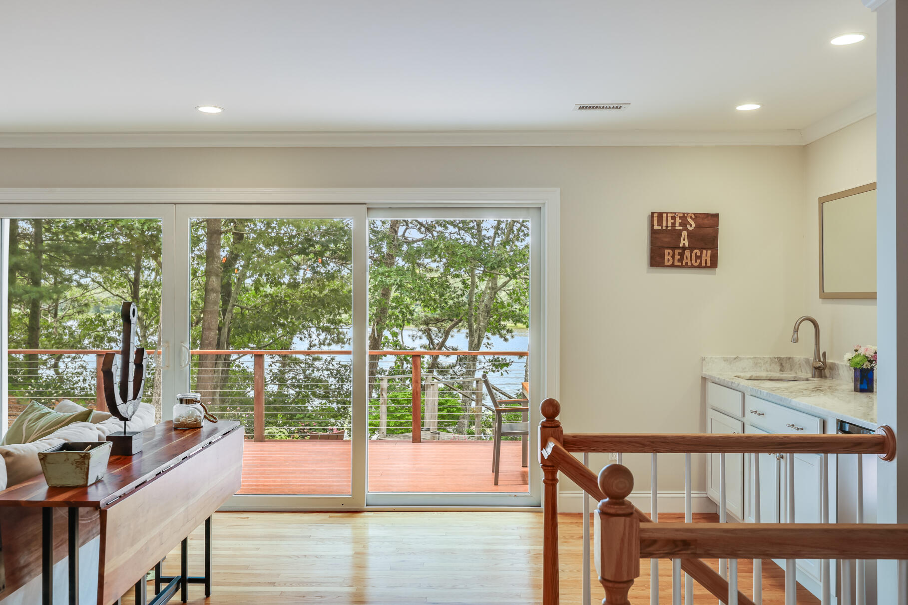 24 Bay Road Cotuit, MA 02635 - Photo 12 of 44 a view of a living room and floor to ceiling window