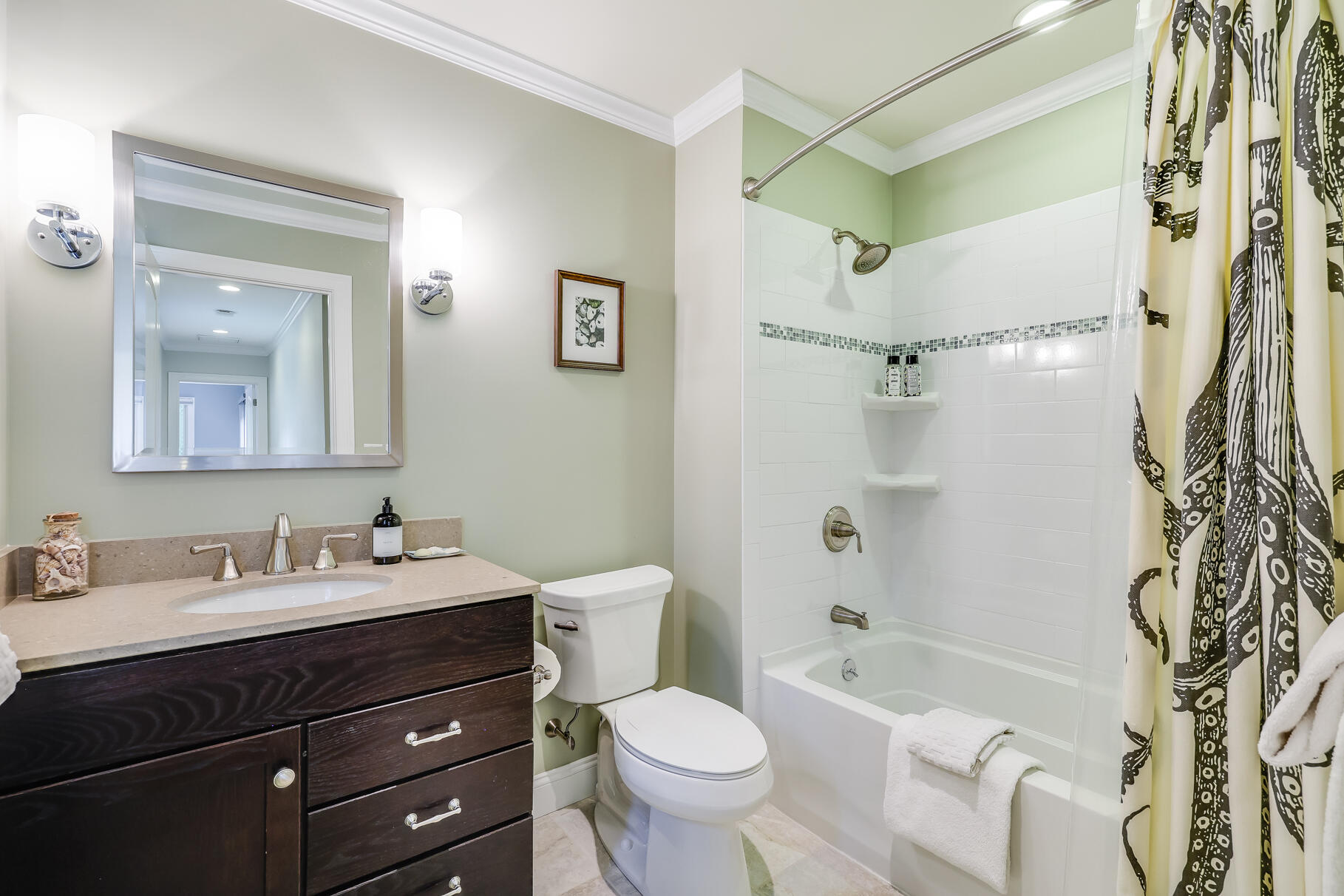 24 Bay Road Cotuit, MA 02635 - Photo 21 of 44 a bathroom with a sink toilet tub and shower