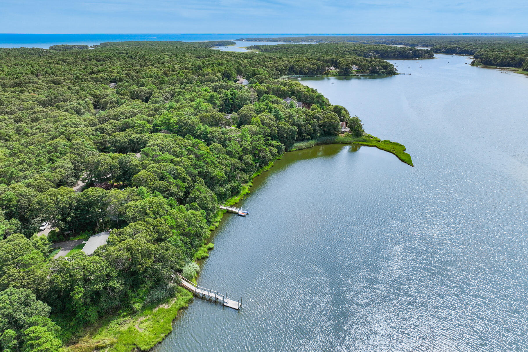 24 Bay Road Cotuit, MA 02635 - Photo 36 of 44 a view of a lake with a city