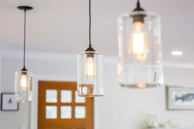 a living room with fireplace furniture and a floor to ceiling window