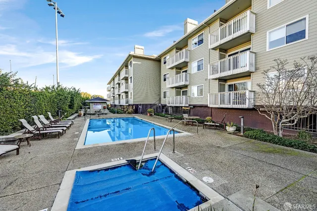 a view of a swimming pool with a lounge chairs
