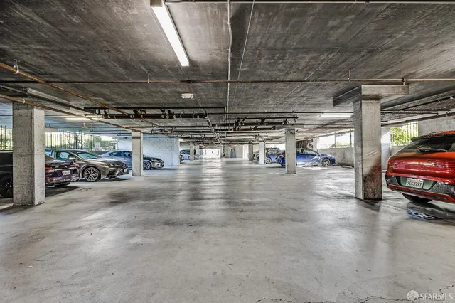 a view of parking garage with cars