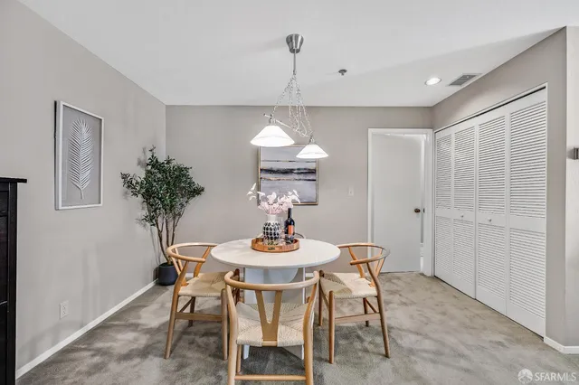 a dining room with furniture and window