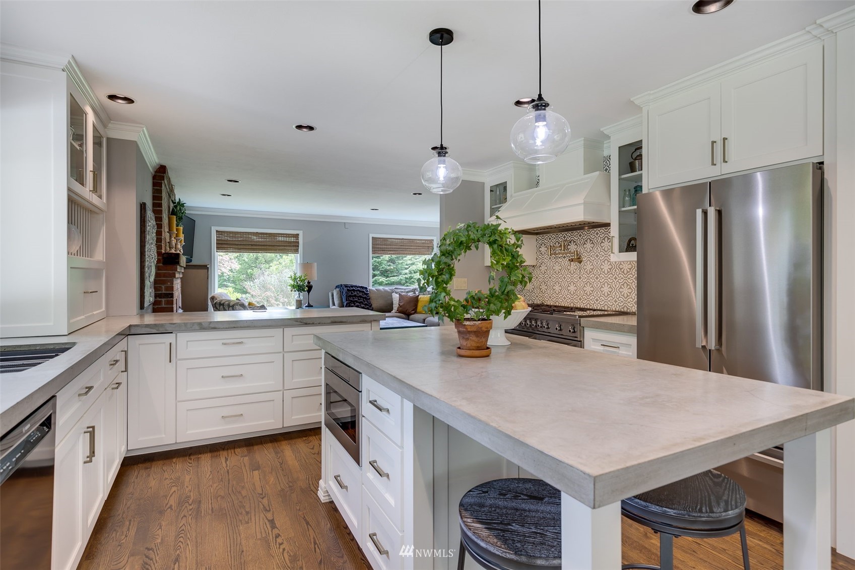 14919 Westwick Road Snohomish, WA 98290 - Photo 11 of 37 a kitchen with stainless steel appliances kitchen island a refrigerator sink and stove
