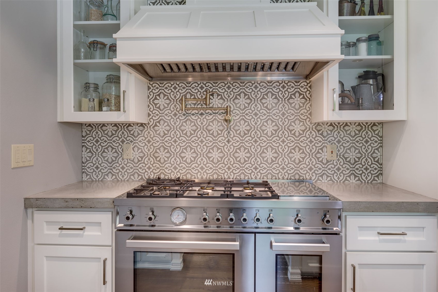 14919 Westwick Road Snohomish, WA 98290 - Photo 12 of 37 a stove top oven sitting inside of a kitchen