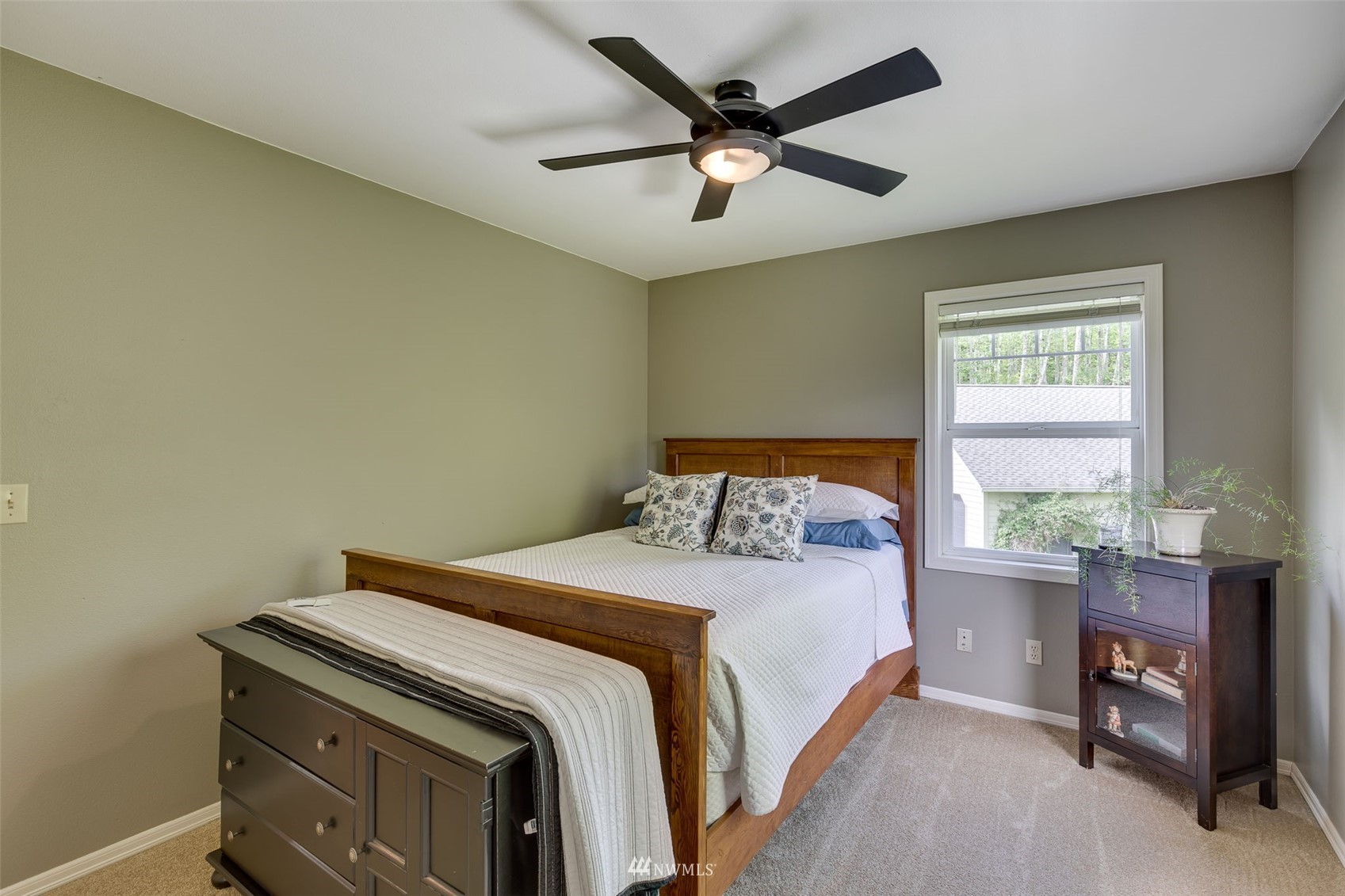 14919 Westwick Road Snohomish, WA 98290 - Photo 20 of 37 a bedroom with a bed and a table in it