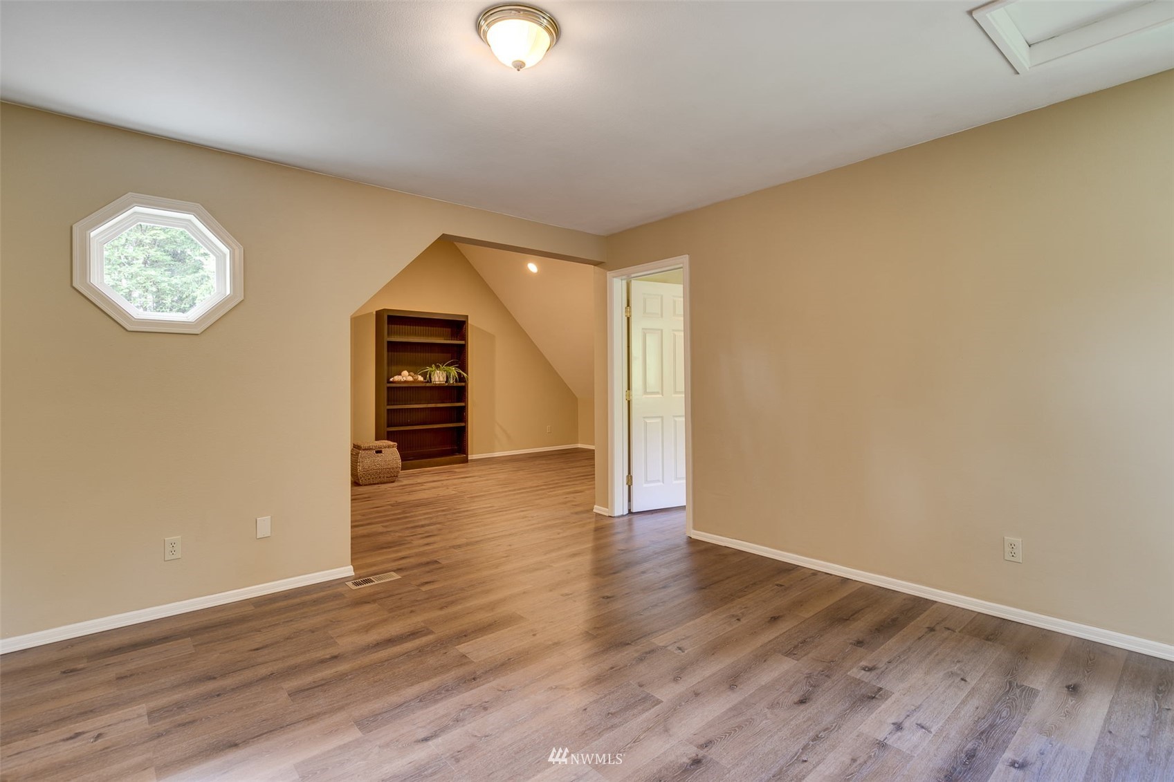 14919 Westwick Road Snohomish, WA 98290 - Photo 23 of 37 an empty room with wooden floor closet and windows