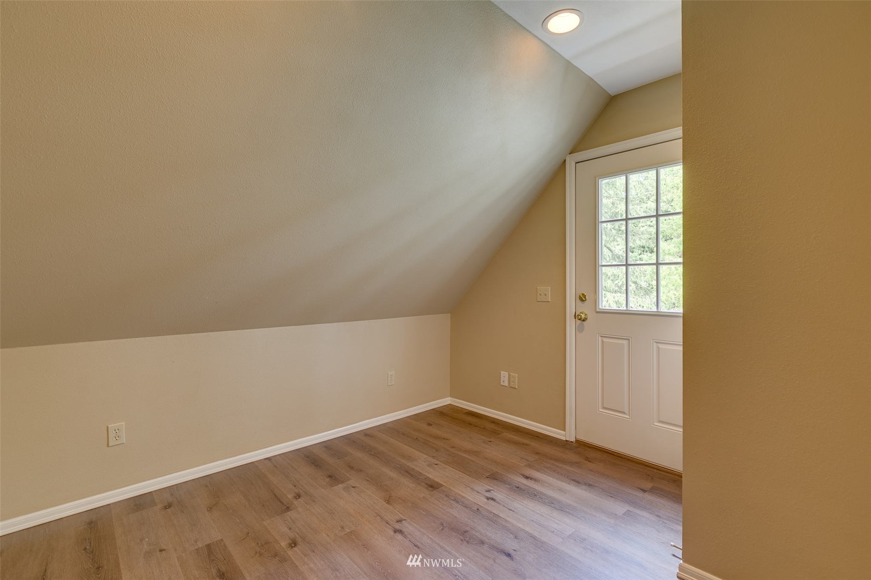 14919 Westwick Road Snohomish, WA 98290 - Photo 24 of 37 an empty room with wooden floor and windows