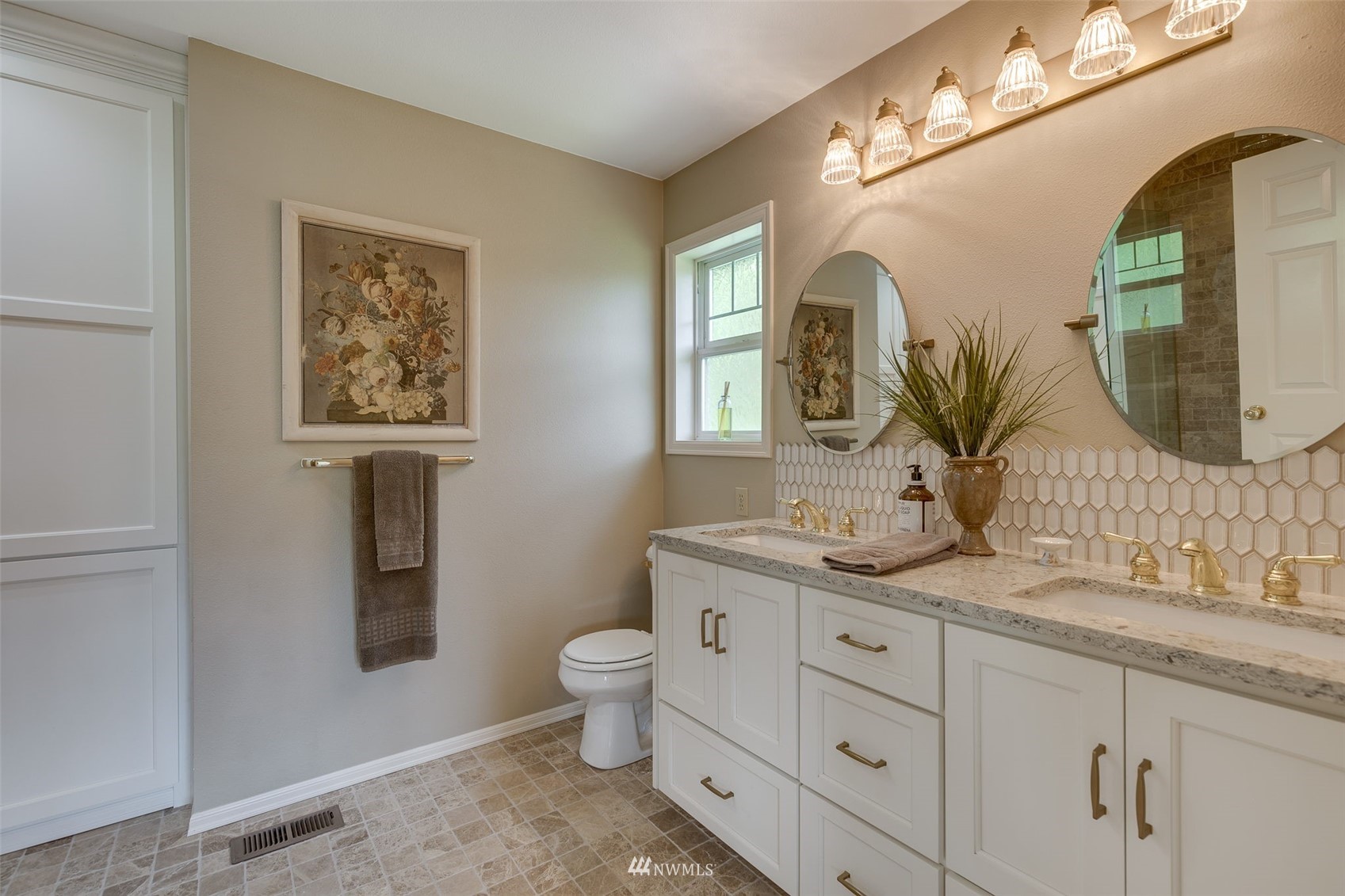 14919 Westwick Road Snohomish, WA 98290 - Photo 28 of 37 a bathroom with a granite countertop toilet sink and mirror