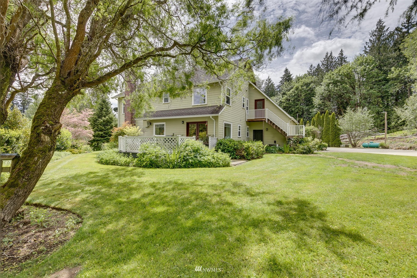 14919 Westwick Road Snohomish, WA 98290 - Photo 37 of 37 a house is sitting in middle of the green field