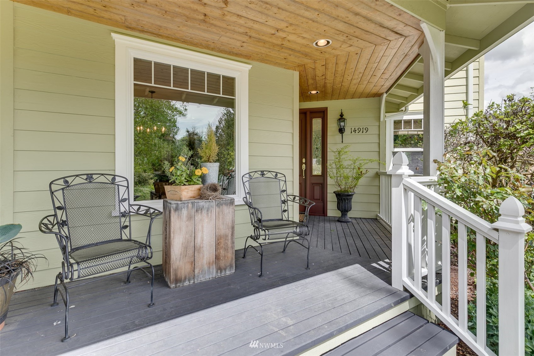 14919 Westwick Road Snohomish, WA 98290 - Photo 4 of 37 a view of a patio with couches table and chairs and wooden floor