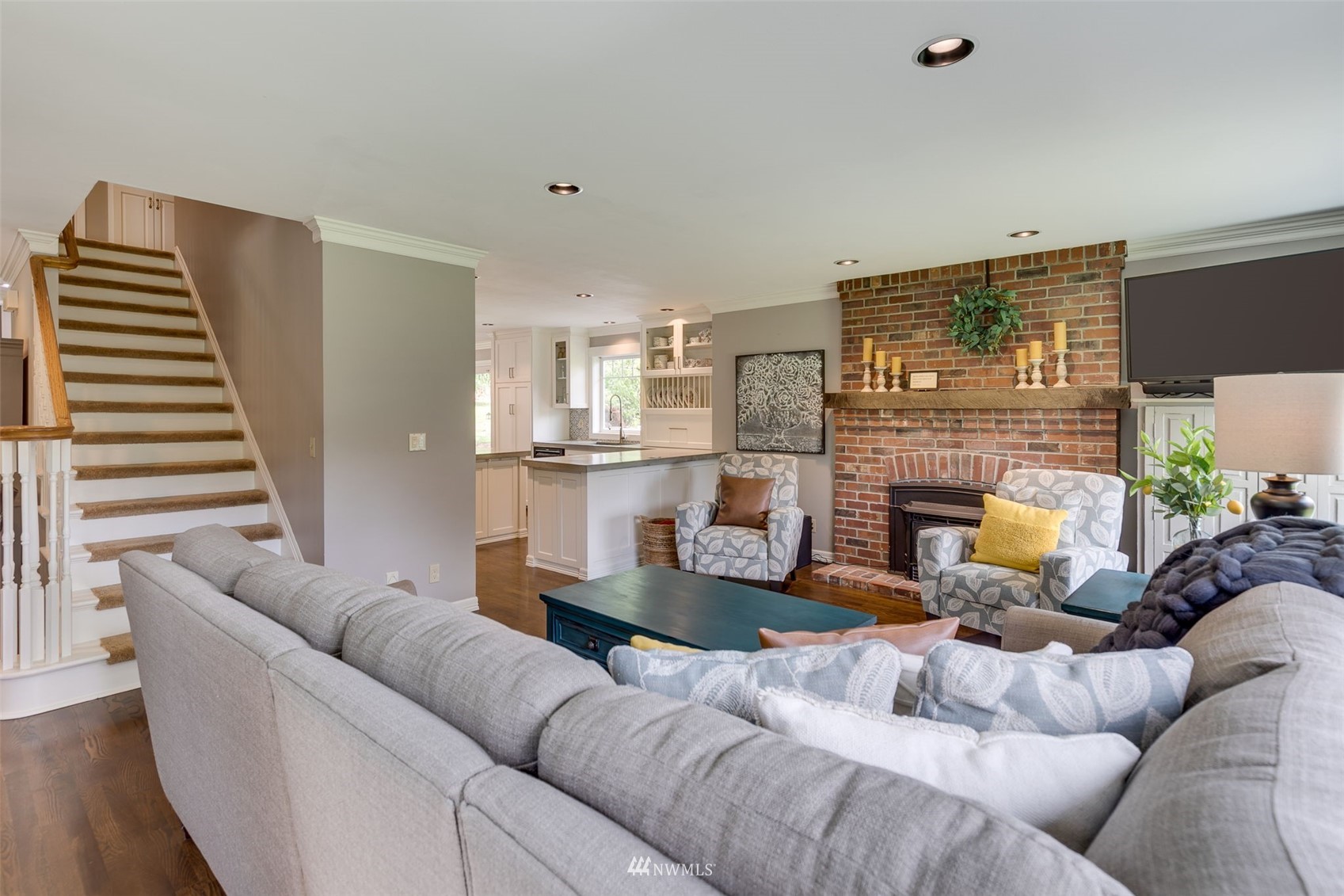 14919 Westwick Road Snohomish, WA 98290 - Photo 7 of 37 a living room with furniture and a fireplace