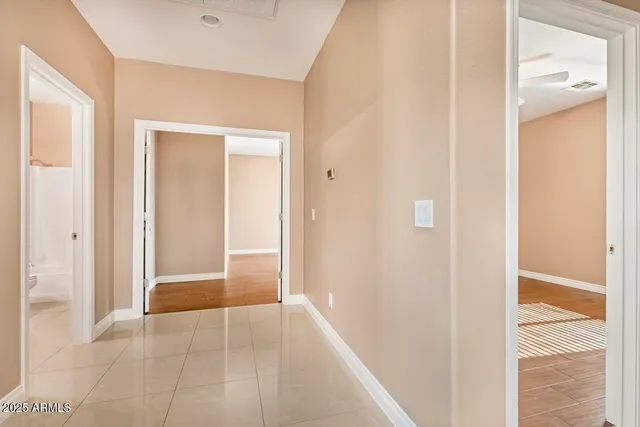 a view of staircase with railing and a window