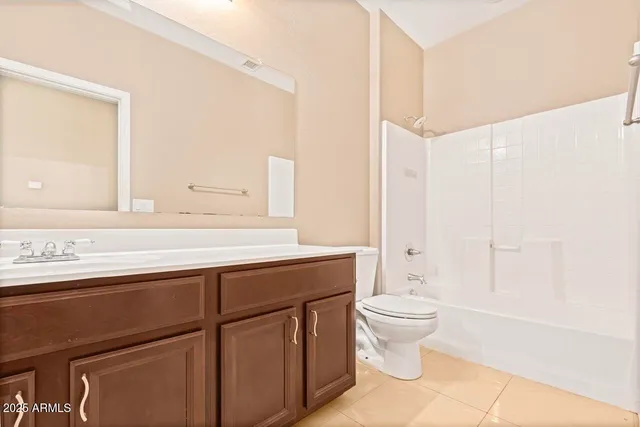 a view of a room with wooden floor and window