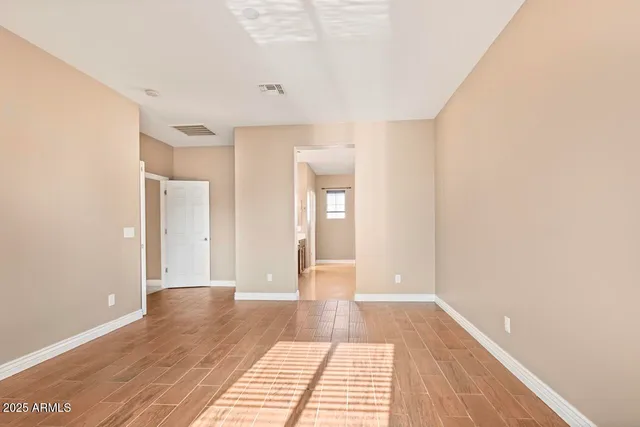 a bathroom with a granite countertop sink a large mirror and a bathtub