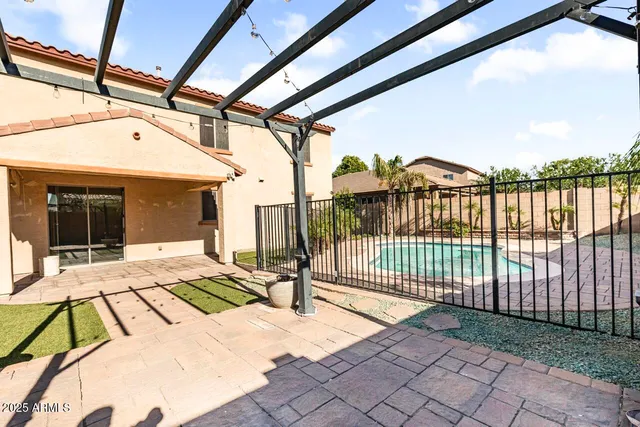 a view of a swimming pool with an outdoor seating