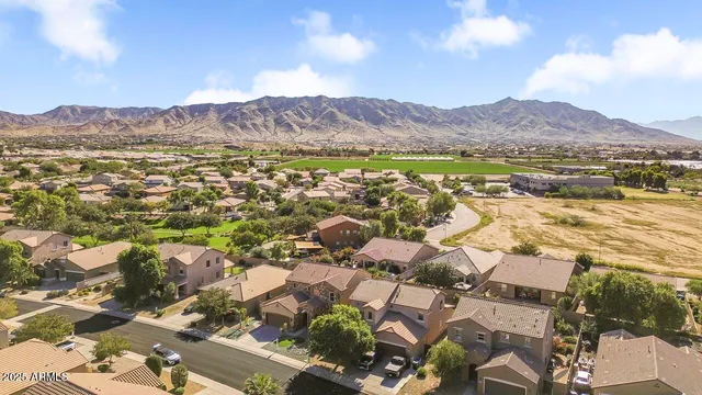 a view of a patio with table and chairs potted plants