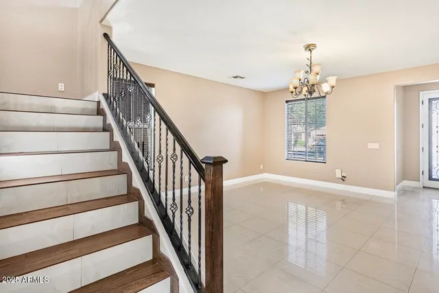a large kitchen with a stove a sink and a refrigerator