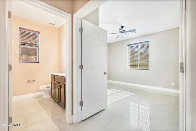 a kitchen with a stove cabinets and a table