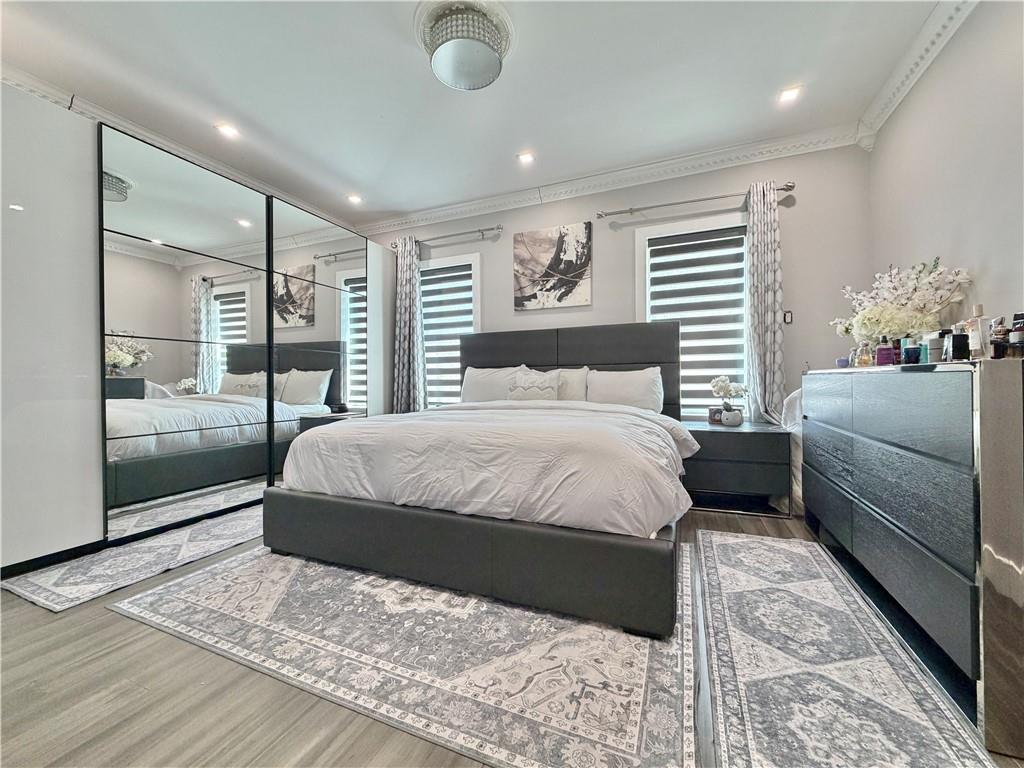 463 82nd Street Brooklyn, NY 11209 - Photo 7 of 16 a bedroom with a large bed and a balcony view
