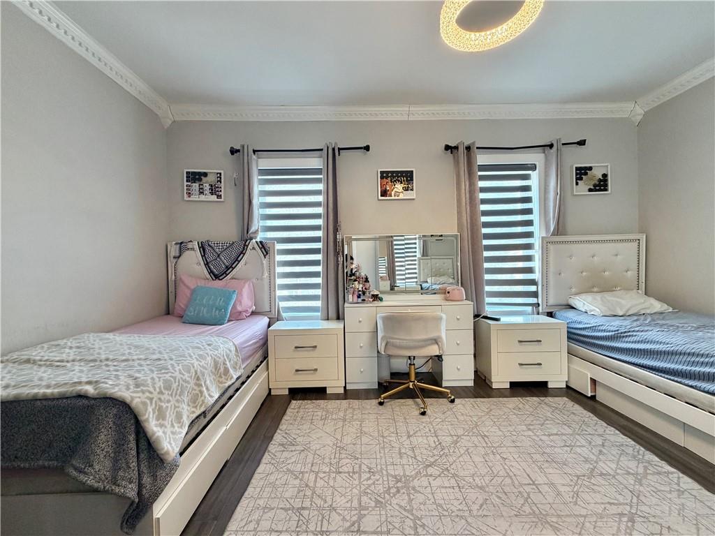 463 82nd Street Brooklyn, NY 11209 - Photo 9 of 16 a bedroom with a bed and a window