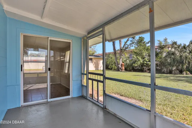 a view of an empty room with a large window