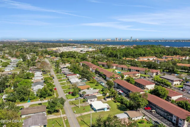 an aerial view of residential houses with outdoor space