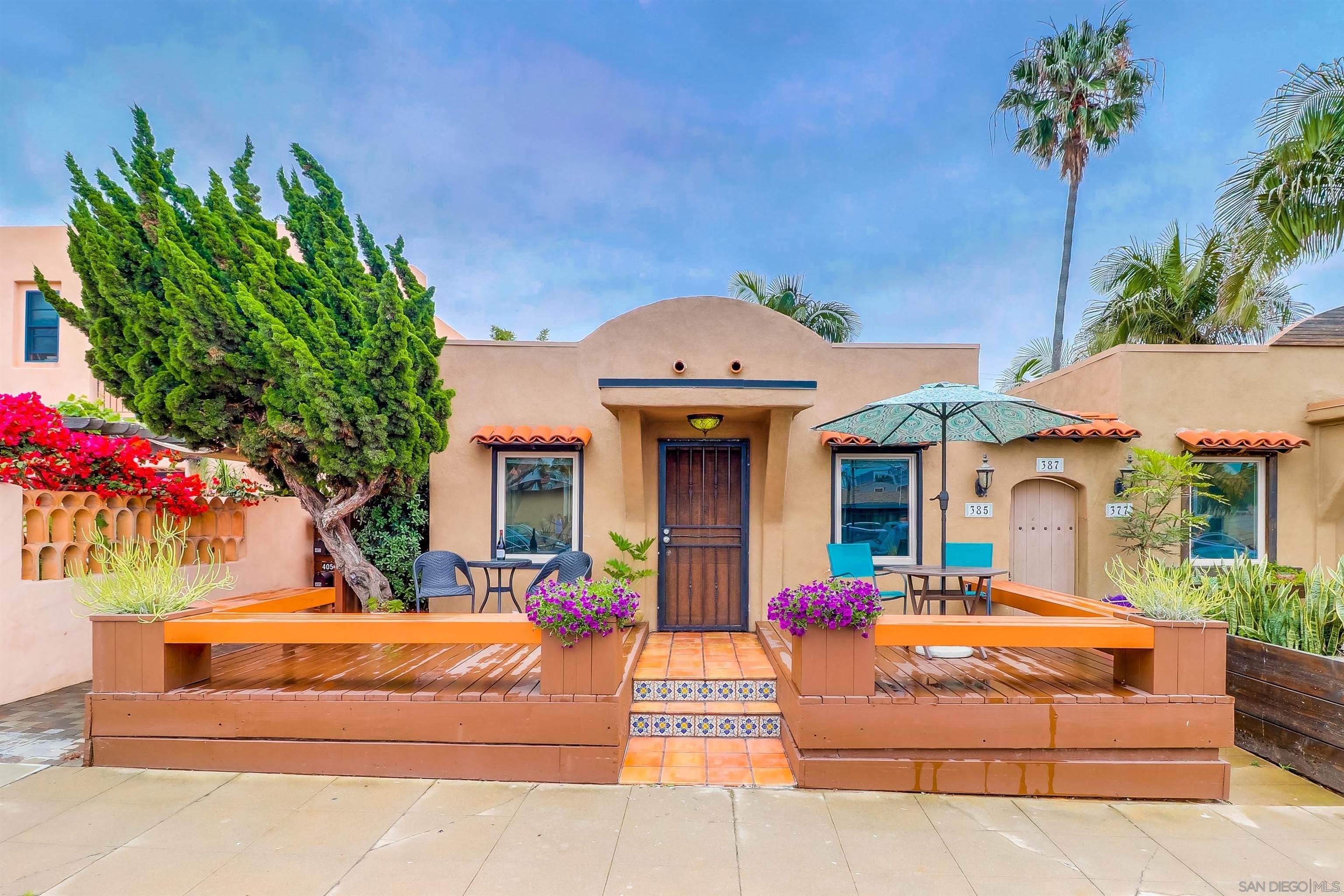 385 Nautilus Street La Jolla, CA 92037 - Photo 1 of 10 a front view of a house with a yard