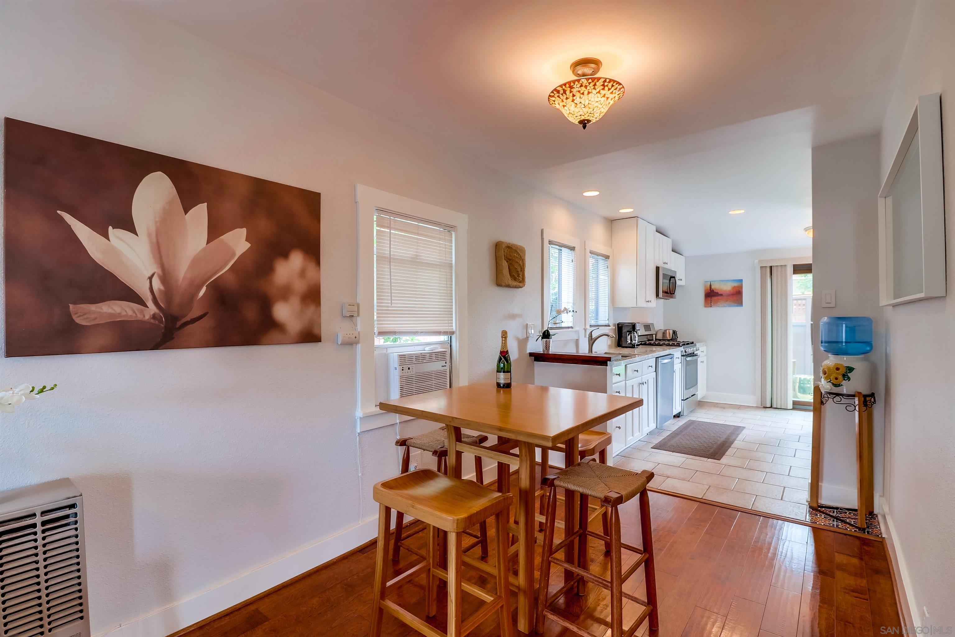 385 Nautilus Street La Jolla, CA 92037 - Photo 6 of 10 a view of a dining room with furniture and wooden floor