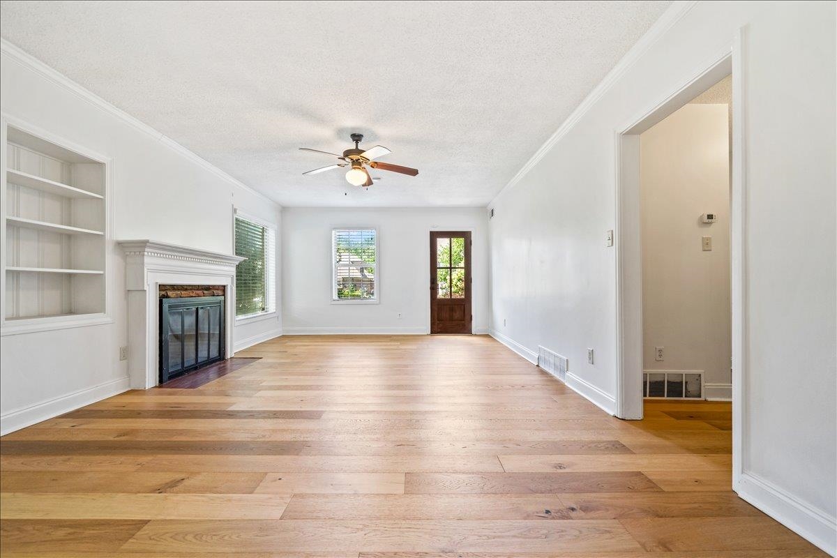 252 Barry Road Memphis, TN 38117 - Photo 8 of 39 spacious living room with decorative fireplace and friends entrance at far right.