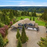 an aerial view of a garden with an outdoor seating