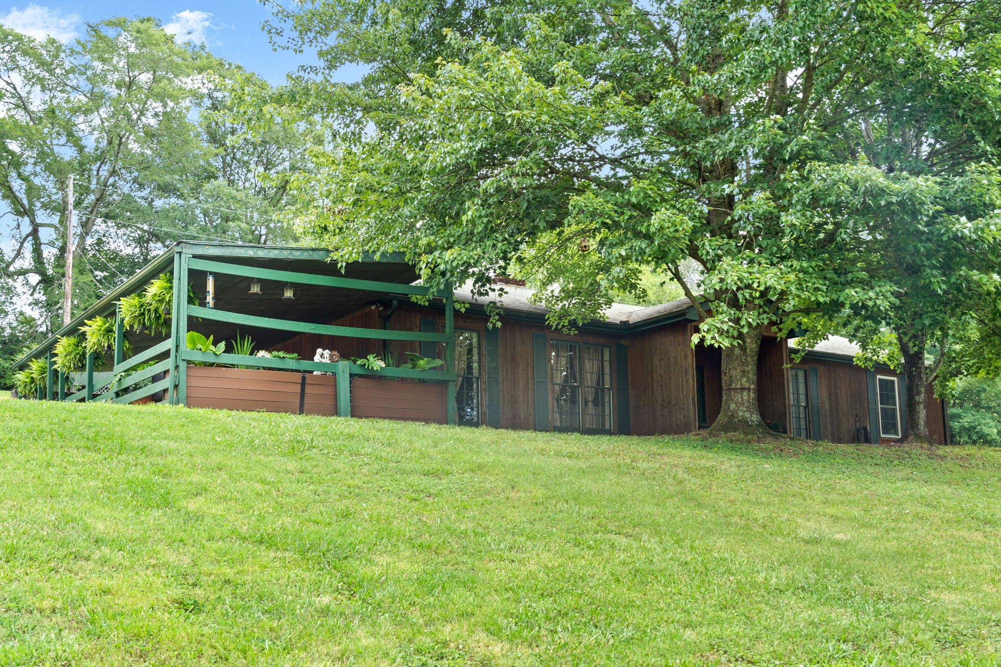 1040 Sensing Road Charlotte, TN 37036 - Photo 12 of 41 a house view with a garden space