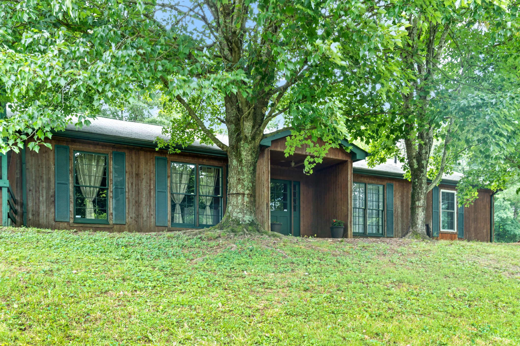 1040 Sensing Road Charlotte, TN 37036 - Photo 15 of 41 front view of a house with a yard