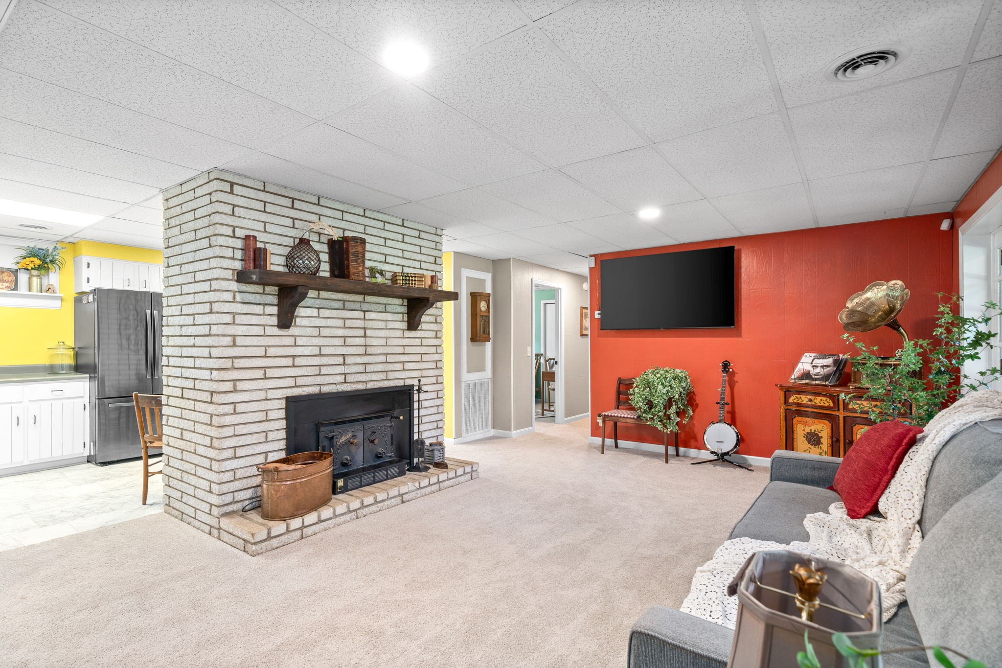 1040 Sensing Road Charlotte, TN 37036 - Photo 23 of 41 a living room with furniture a flat screen tv and a fireplace