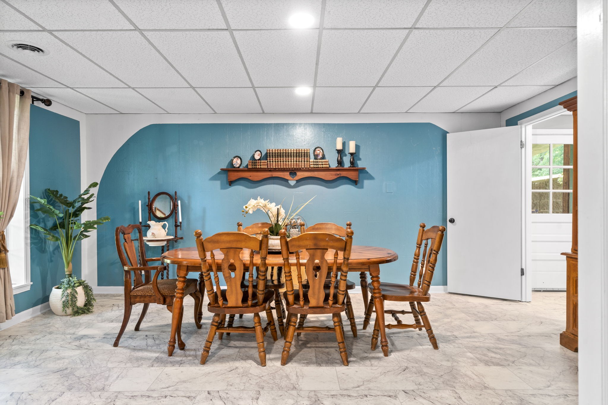 1040 Sensing Road Charlotte, TN 37036 - Photo 25 of 41 a dining room with furniture and a chandelier