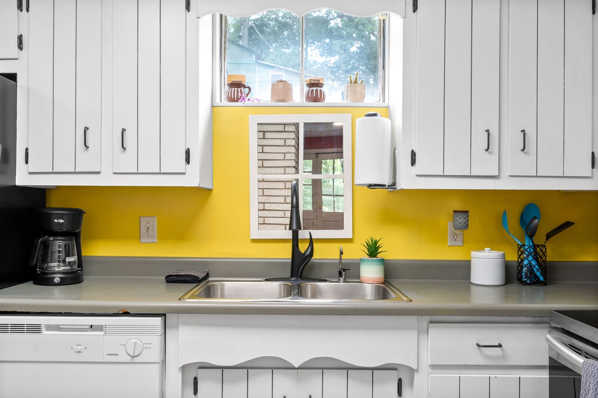 1040 Sensing Road Charlotte, TN 37036 - Photo 29 of 41 a kitchen with stainless steel appliances granite countertop a sink and a window