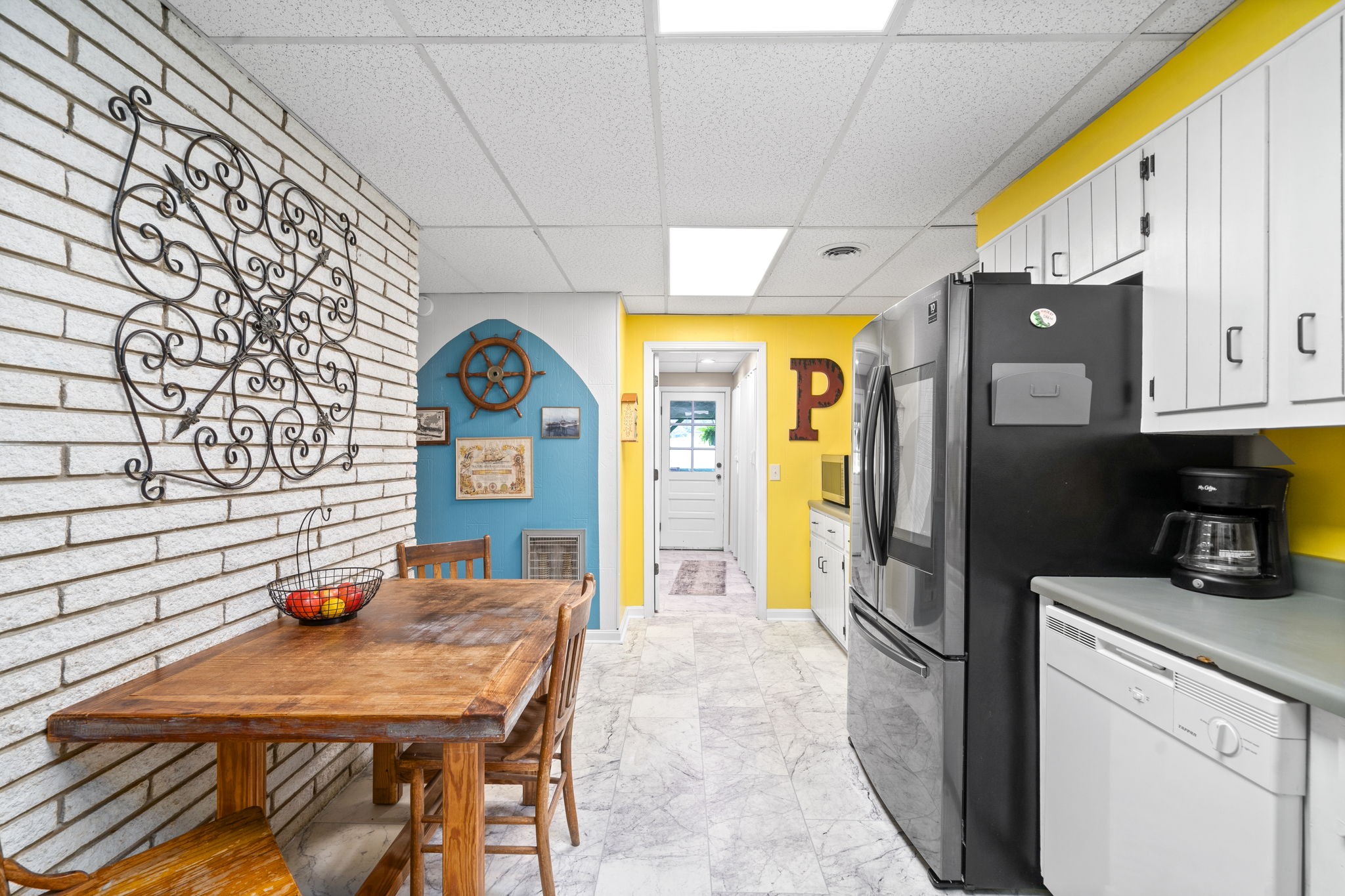 1040 Sensing Road Charlotte, TN 37036 - Photo 31 of 41 a kitchen with stainless steel appliances granite countertop a refrigerator a stove and a wooden cabinets