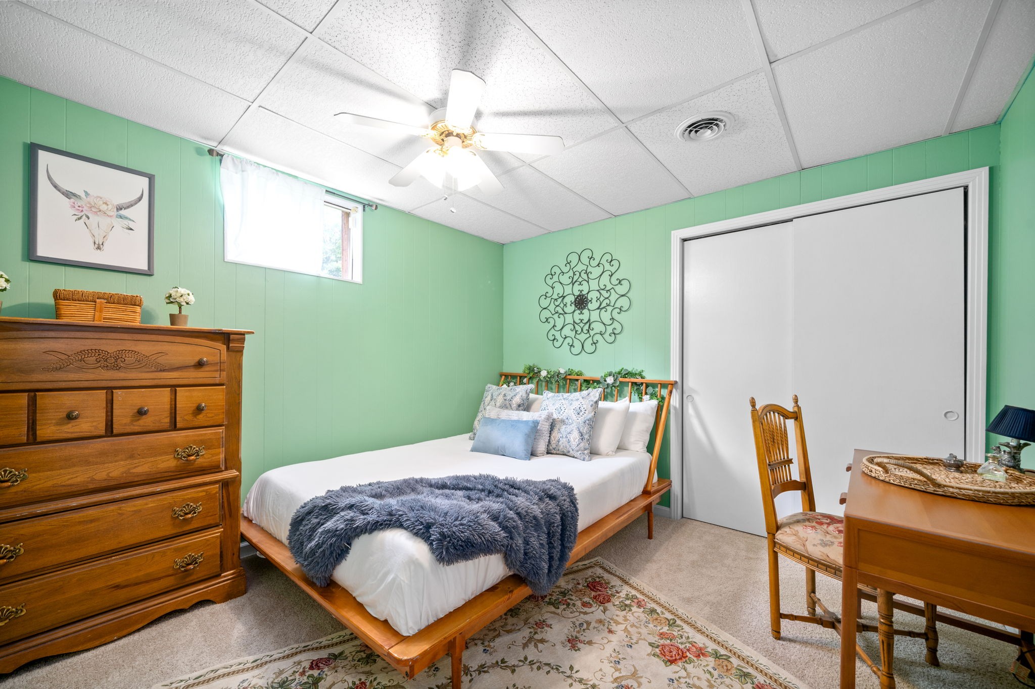 1040 Sensing Road Charlotte, TN 37036 - Photo 33 of 41 a bedroom with a bed and a chandelier