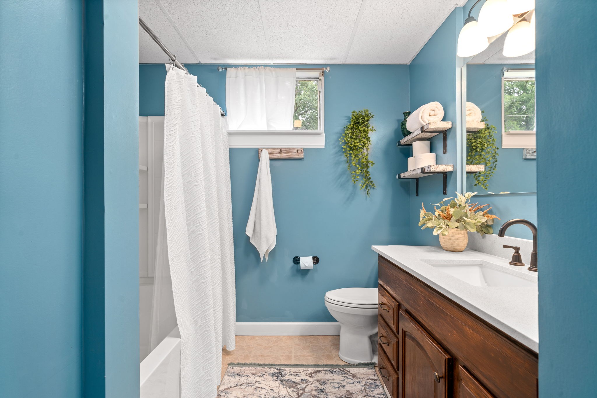 1040 Sensing Road Charlotte, TN 37036 - Photo 34 of 41 a bathroom with a sink toilet and shower
