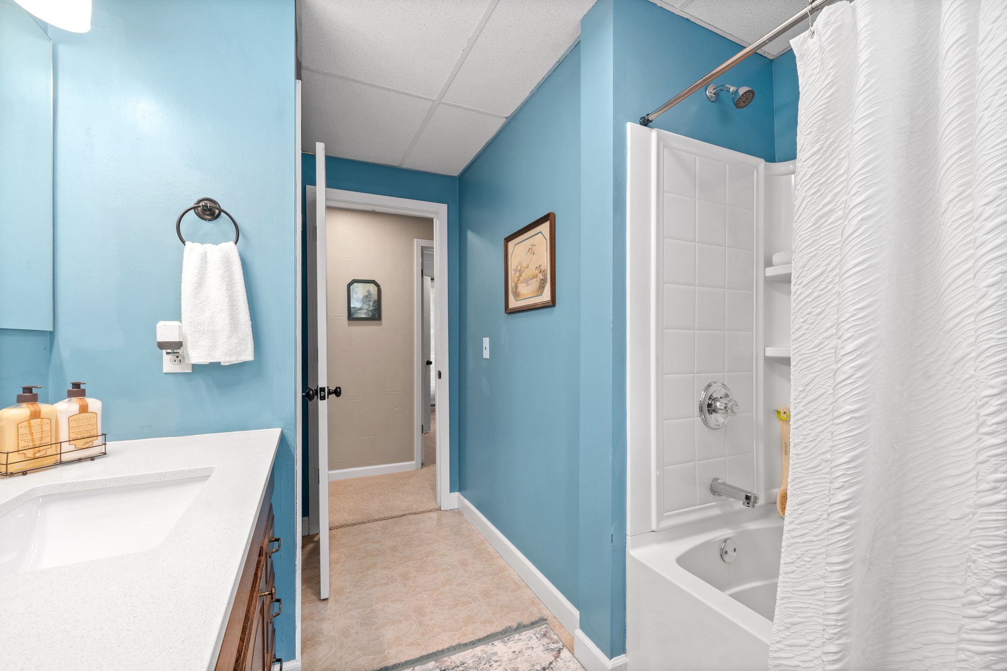 1040 Sensing Road Charlotte, TN 37036 - Photo 35 of 41 a bathroom with a tub sink and mirror