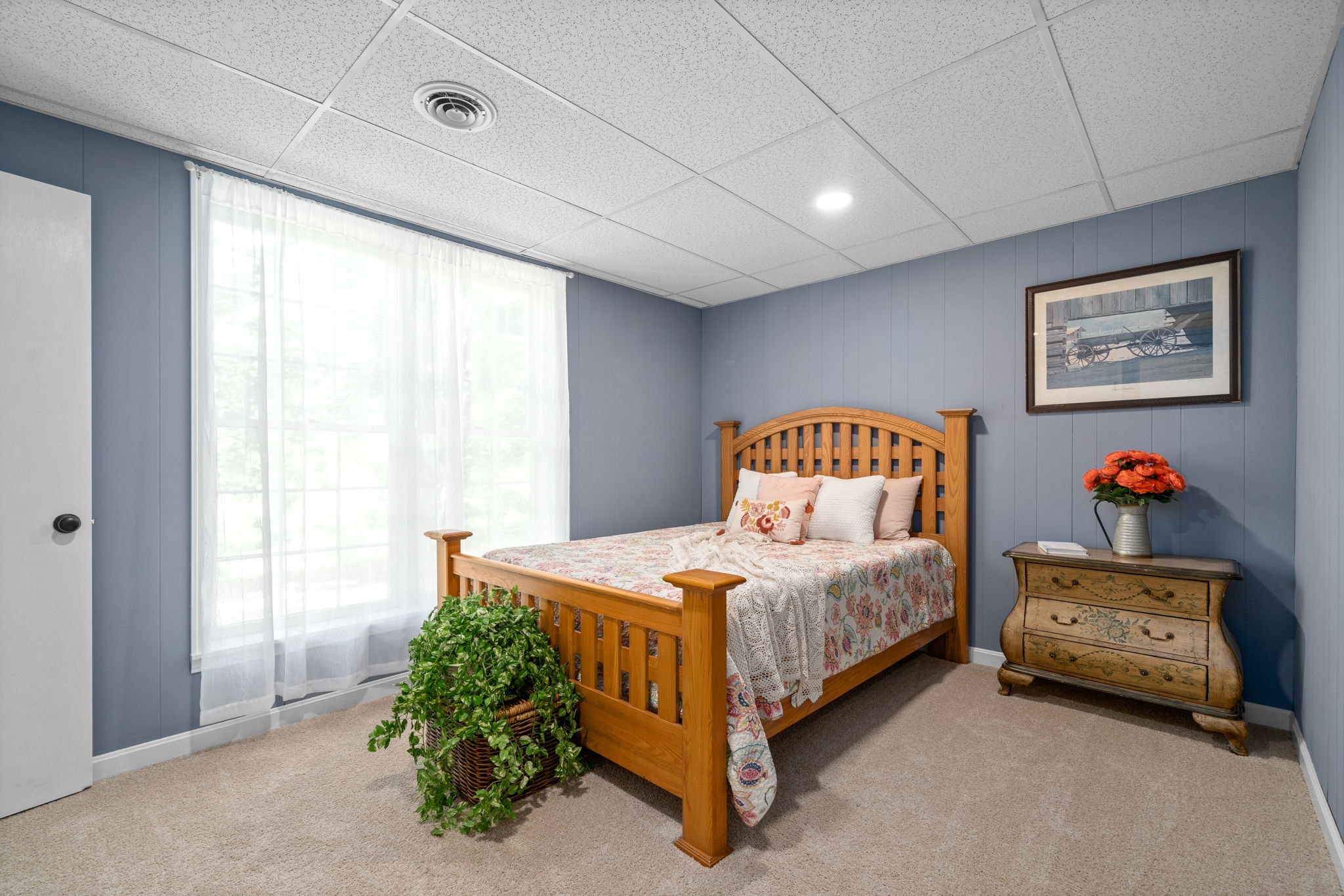 1040 Sensing Road Charlotte, TN 37036 - Photo 37 of 41 a bedroom with a bed and a painting on the wall