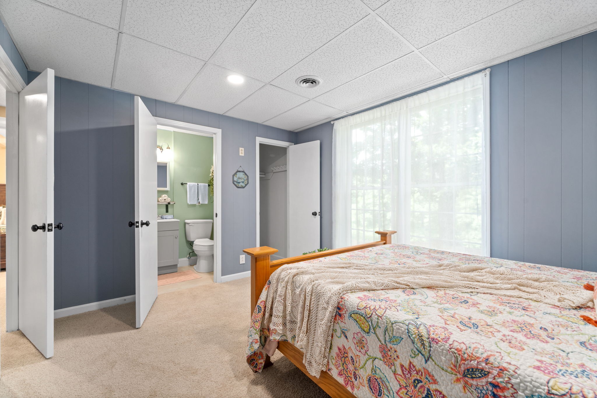 1040 Sensing Road Charlotte, TN 37036 - Photo 38 of 41 a bedroom with a bed and a large window