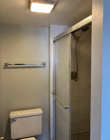 a bathroom with a tub and toilet