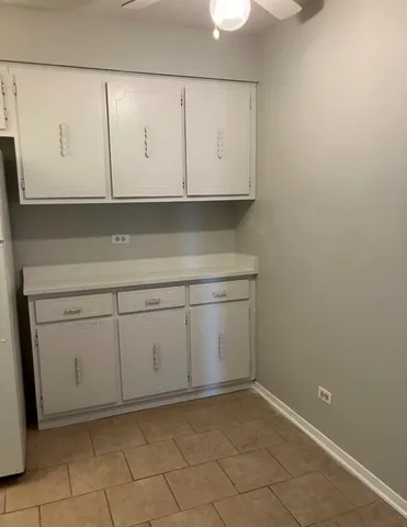 a kitchen with stainless steel appliances a refrigerator and a stove